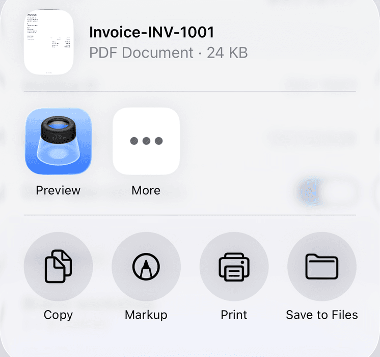The share sheet with an Invoixy invoice PDF ready to send